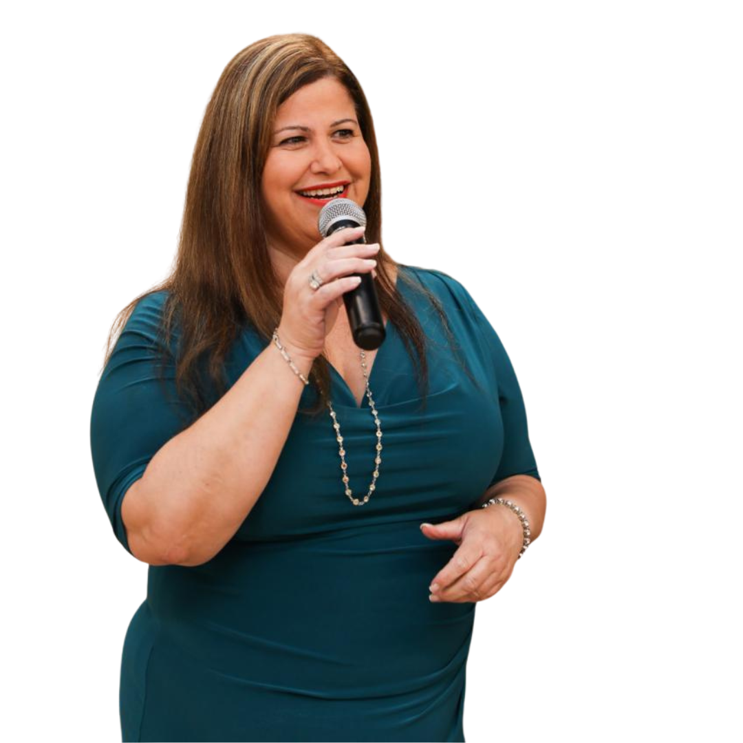 Orly Amor speaking on stage with a microphone, coaching paid public speakers